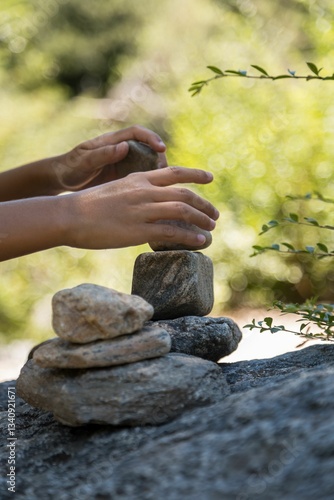 Canvas Print Hands Stacking Stones Outdoors