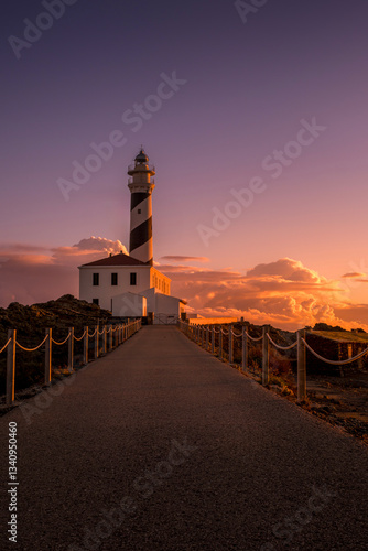 Obraz na płótnie Cape Favaritx Lighthouse in Minorca at dawn, Spain, offering serene coastal views. Sunrise at the Lighthouse on the northeastern coast of Menorca in the Balearic Islands. Biosphere Reserve. w salonie