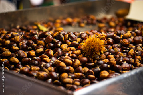 roasted chestnuts, for sale at a street market food stall