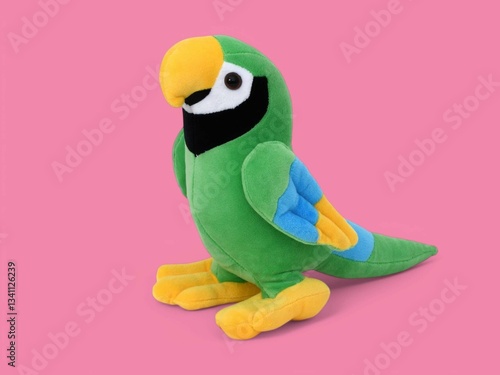 Colorful green parrot toy on the pink background