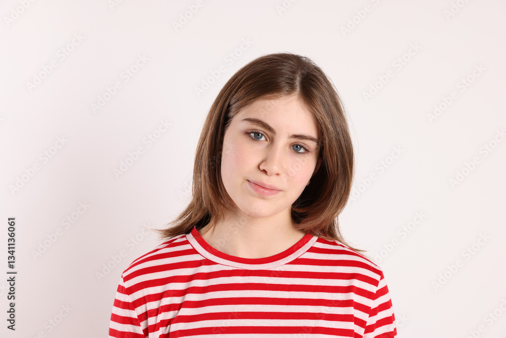 Portrait of beautiful teenage girl on light background Portrait of beautiful teenage girl on light background
