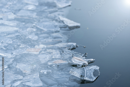 breaking the ice sheet in the lake - winter swimming - frost - cold, refreshing water