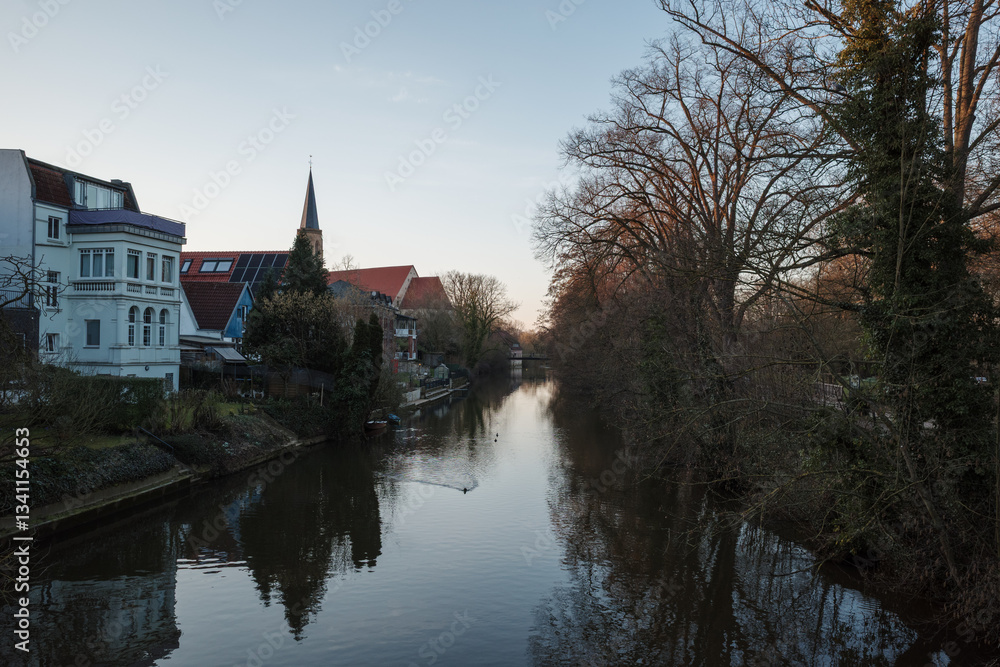 Outdoor scenery over the bridge and ems river in Telgte, Germany during sunset. Outdoor scenery over the bridge and ems river in Telgte, Germany during sunset.