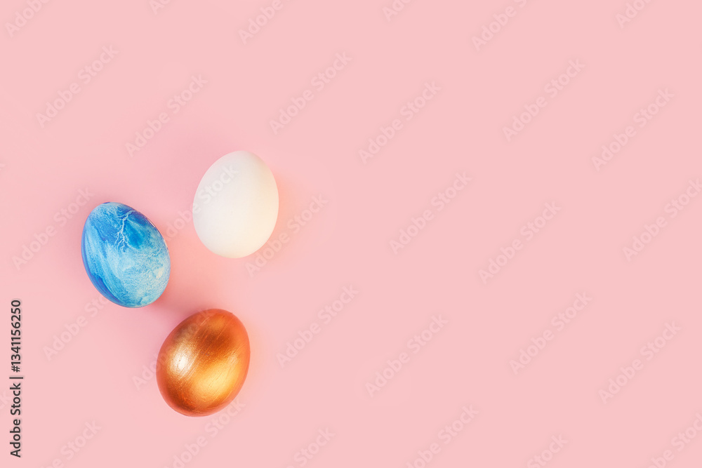 Frame of Easter colorful blue golden and white color eggs on pastel pink background. Stylish trendy gold chocolate egg set isolated. Flat lay, top view, place for text. Happy egg hunt for kids concept Frame of Easter colorful blue golden and white color eggs on pastel pink background. Stylish trendy gold chocolate egg set isolated. Flat lay, top view, place for text. Happy egg hunt for kids concept
