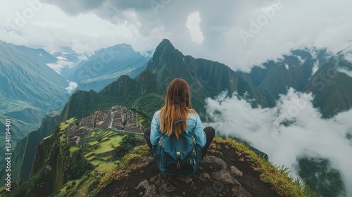 Perched on a rock, a female traveler wearing an orange backpack gazes out at the awe-inspiring vista of Machu Picchu and the Andes mountains