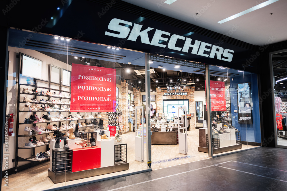 Fototapeta premium Shoe Skechers storefront with display and sale signage during a shopping promotion