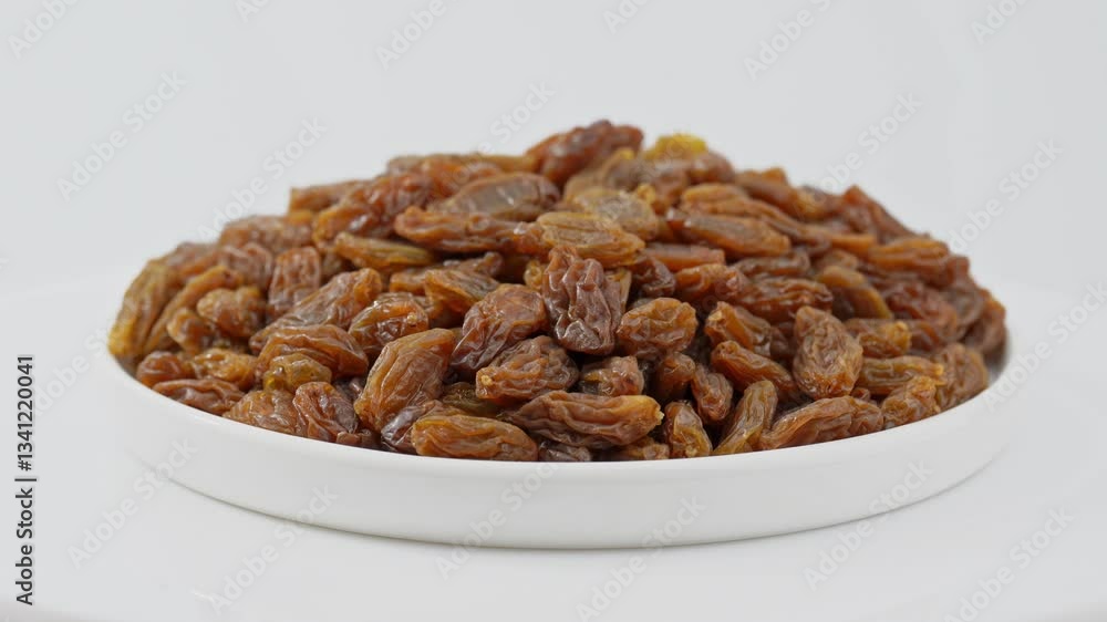 Raisins on a white background. Dried grapes. Raisins on a white background. Dried grapes.