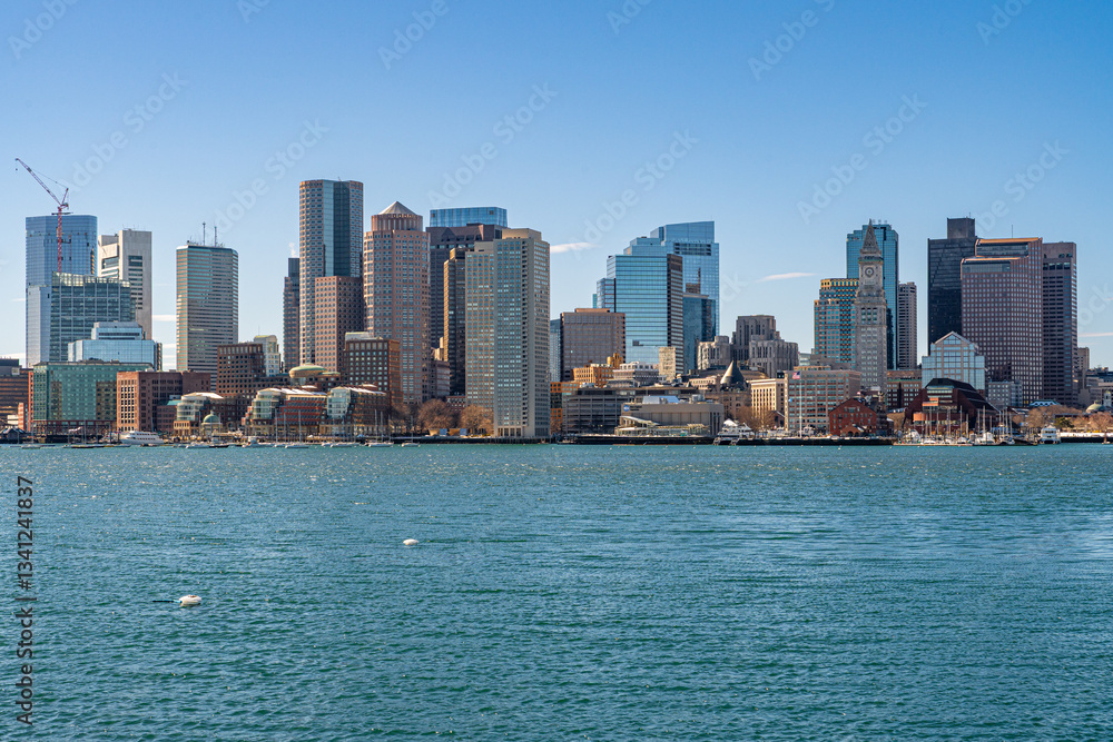 Fototapeta premium View of Boston skyline and skyscrapers in February winter seen from Piers Park in Boston, MA