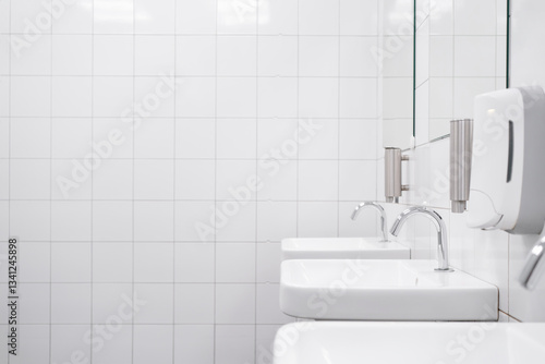 White colour ceramic tiles toilet hand wash area. White colour theme toilet interior. Cleanliness concept. Clean toilet concept.