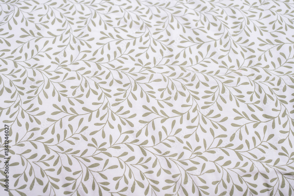 Fototapeta premium Close up leaf on whitefabric pattern background.