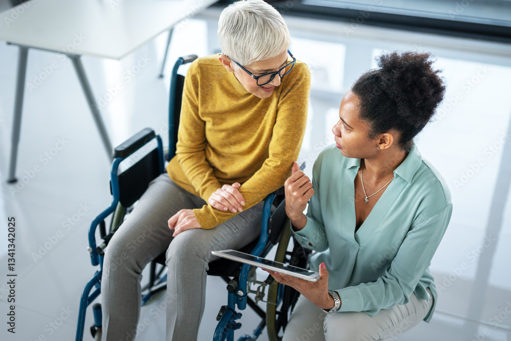 The image includes a person using a wheelchair, depicting inclusivity and teamwork in modern office