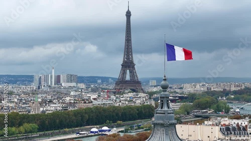 French flag on Grand Palais dome and Eiffel Tower (Tour Effeil) in Paris, France