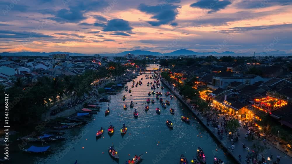 Drone video Hoi An, Vietnam in Quang Nam Province is a popular tourist destination, with colorful lantern boats sailing along the river at night.