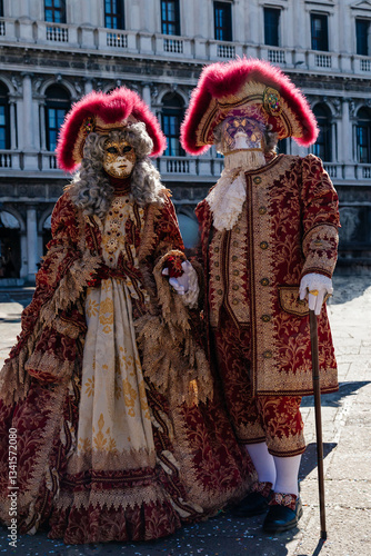 Venetian Carnival Duo: Traditional Masks and Attire
