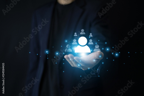 Businessman using CRM to analyze customer behavior allows businesses to refine marketing strategies and boost sales effectively. Customer relationship management concept.