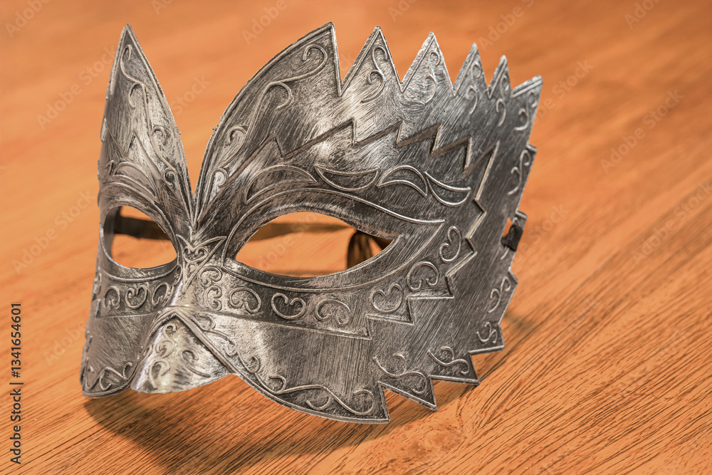 Venetian carnival mask on a wooden table