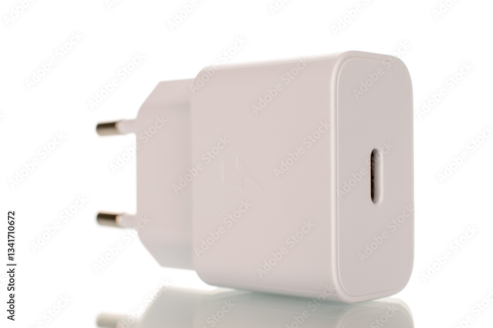 One power adapter for smartphone isolated on white background, close-up. One power adapter for smartphone isolated on white background, close-up.