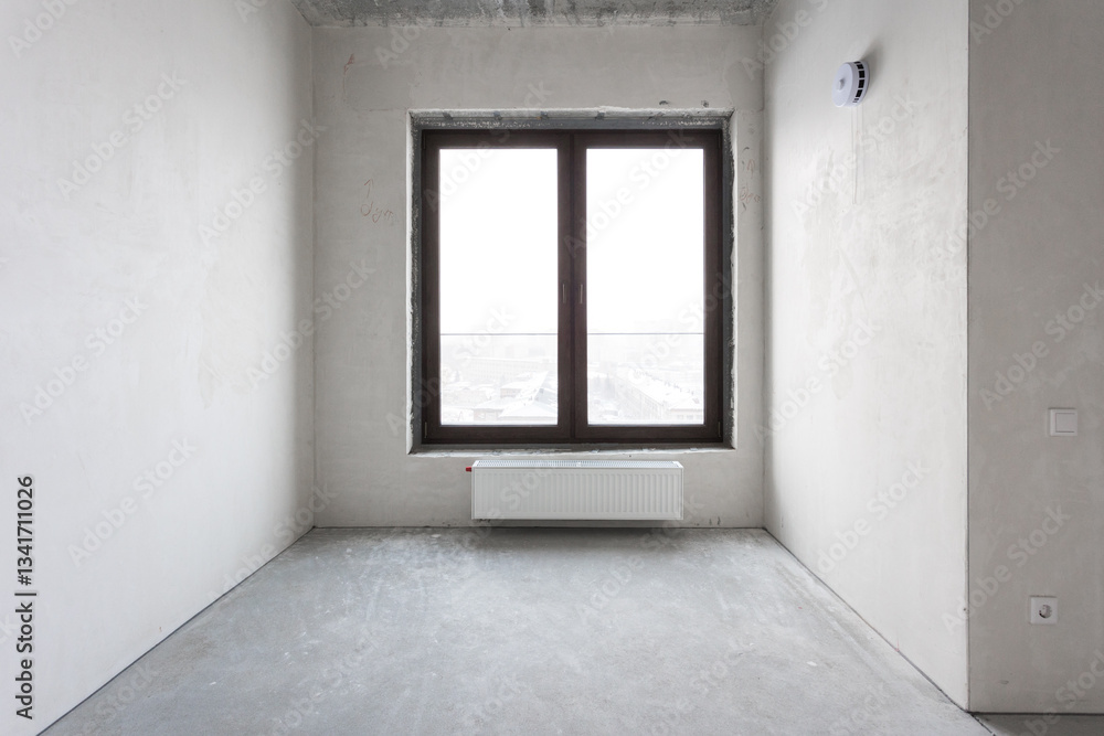Fototapeta premium interior of the apartment without decoration in gray colors. rough finish