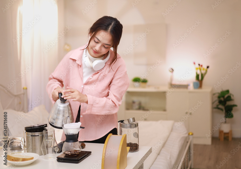 Happy Asian woman making morning coffee at home. Vacation. Happy Asian woman making morning coffee at home. Vacation.