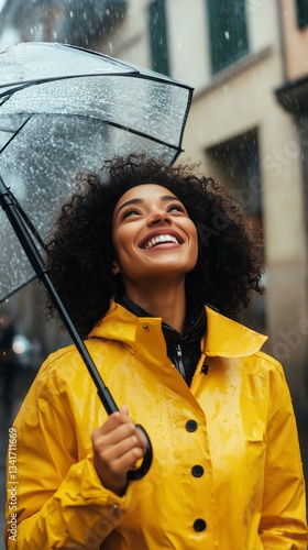 Woman in Yellow Raincoat Smiles Under Umbrella During Rainy Day in City Street