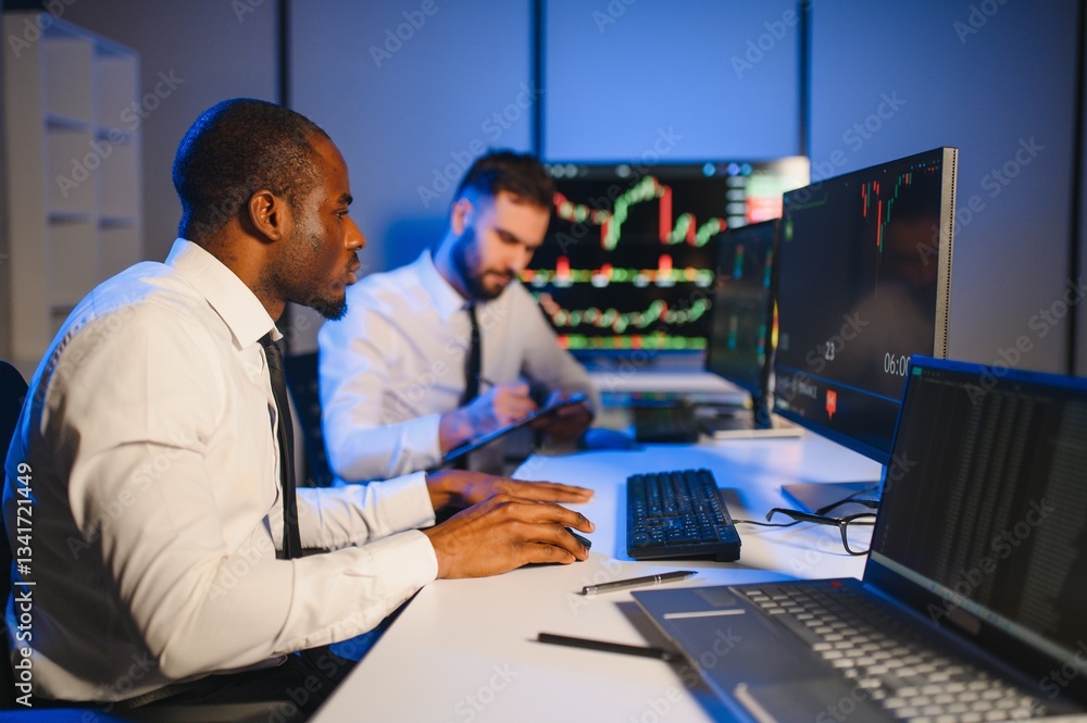 Conception of teamwork. Team of stockbrokers works in modern office with many display screens Conception of teamwork. Team of stockbrokers works in modern office with many display screens