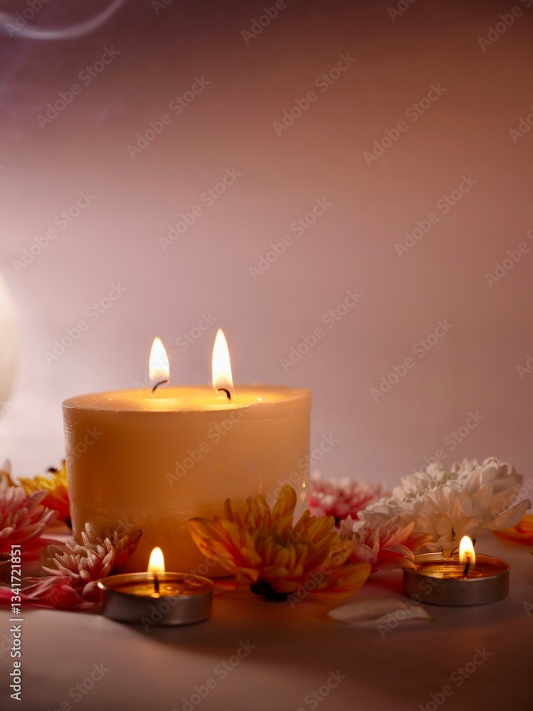 Celebration of Diwali or Deepavali holiday in India with candles and flowers in the evening at night close-up. Hindus celebrate the festival of lights, vertical Celebration of Diwali or Deepavali holiday in India with candles and flowers in the evening at night close-up. Hindus celebrate the festival of lights, vertical