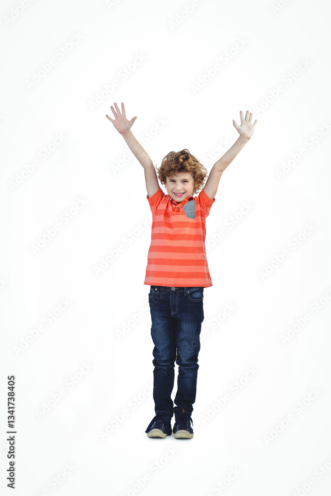 Joyful child in striped shirt raising arms, smiling with excitement in studio Joyful child in striped shirt raising arms, smiling with excitement in studio