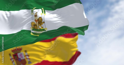 Flags of Andalusia and Spain waving together