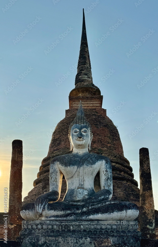 A statue of sitting Buddha in Sukhothai Historical Park in Thailand