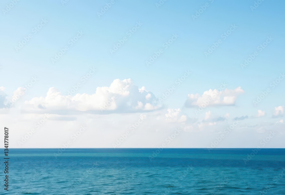 Obraz premium Soft, pale blue sky, scattered clouds above calm blue sea, bluesea, landscape