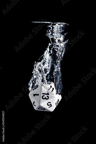 Splash photography of a 20 faces dice dropped in water with black background