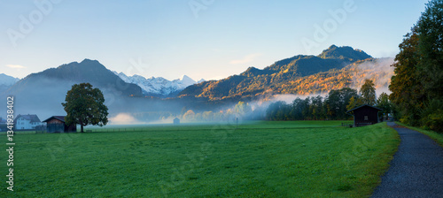 Obraz na płótnie morning landscape with some fog, tourist resort Oberstdorf, allgau alps and green meadow w salonie