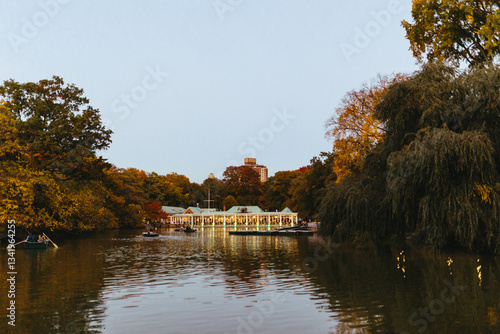 Tranquility on a lake surrounded by autumn trees in Central Park photo