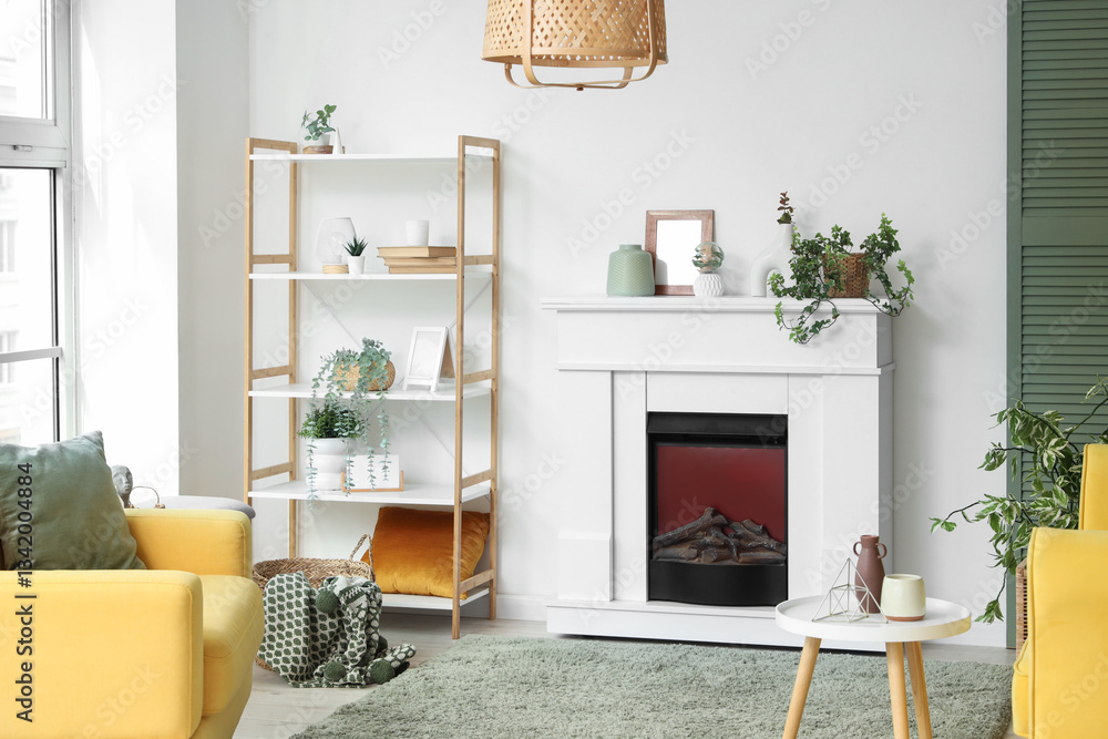 Naklejka premium Interior of living room with electric fireplace, shelf unit and houseplants
