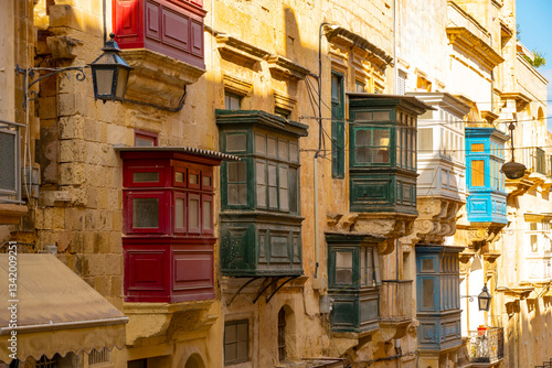 Photos Typical narrow streets with colorful balconies in VallettaTypical narrow streets with colorful balconies