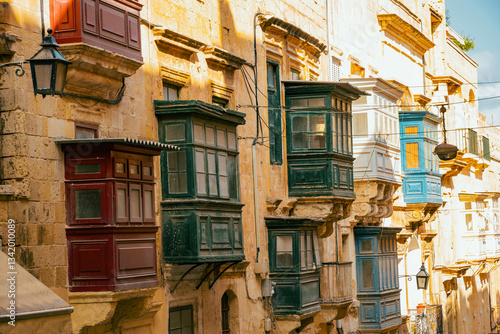 Papier peint Typical narrow streets with colorful balconies in VallettaTypical narrow streets with colorful balconies