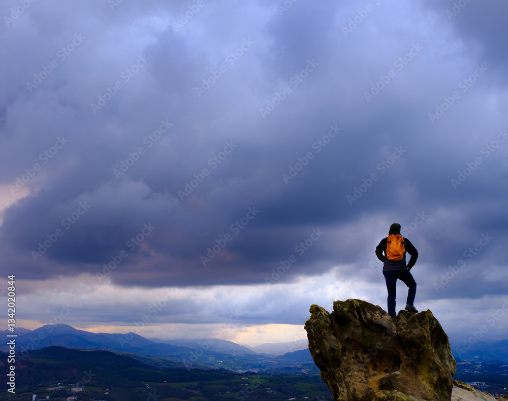 Storm clouds and bad weather. Man in front of bad weather with very cloudy skies.