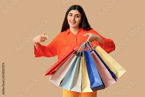 Happy smiling young woman p...
