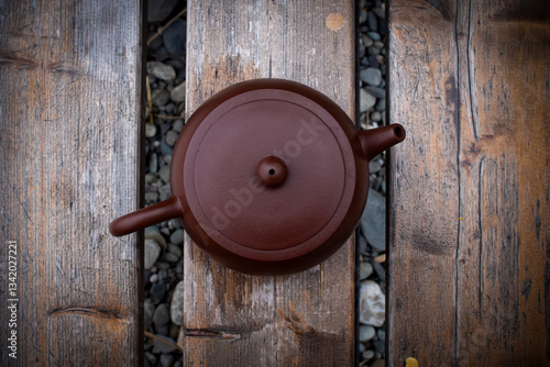 Wallpaper Mural a teapot with tea for the Chinese tea ceremony stands on wooden bars Torontodigital.ca