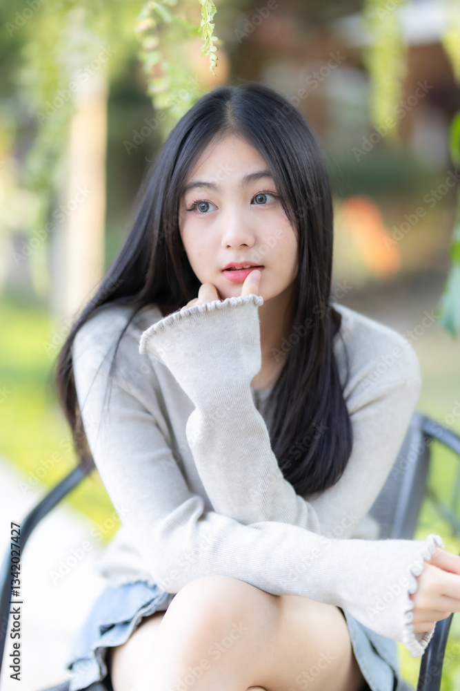 Portrait cute smiles Asian of attractive young teenage girl the cafe on vacation at a coffee shop in spring day