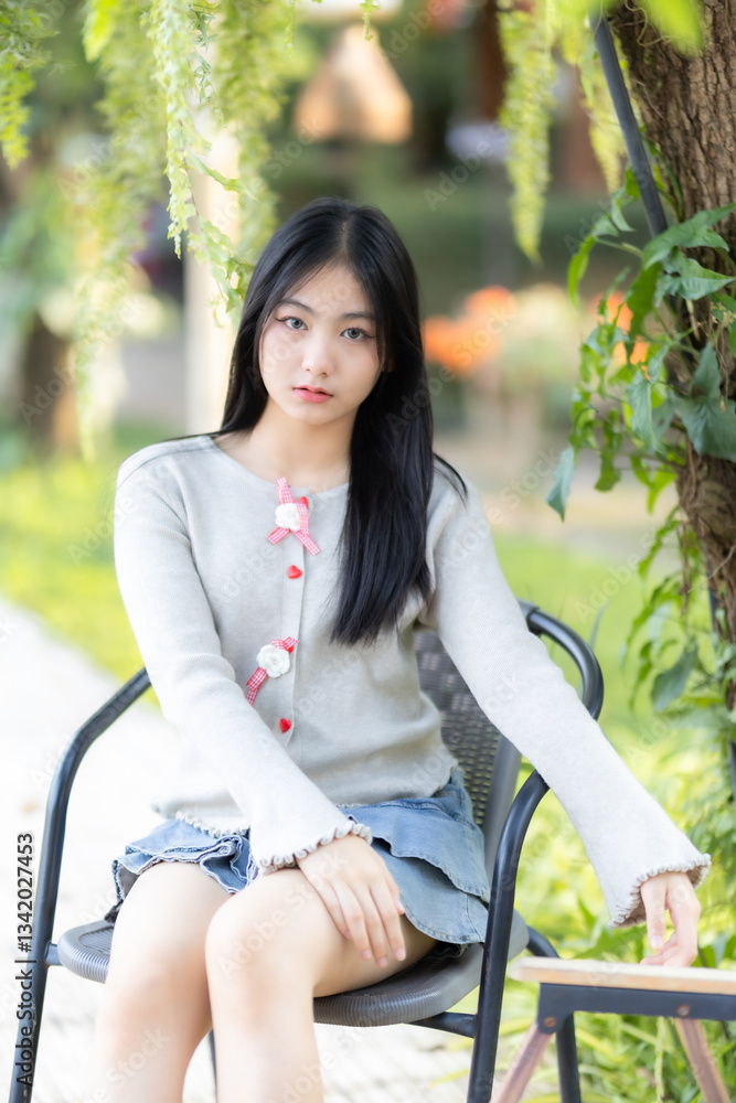 Portrait cute smiles Asian of attractive young teenage girl the cafe on vacation at a coffee shop in spring day