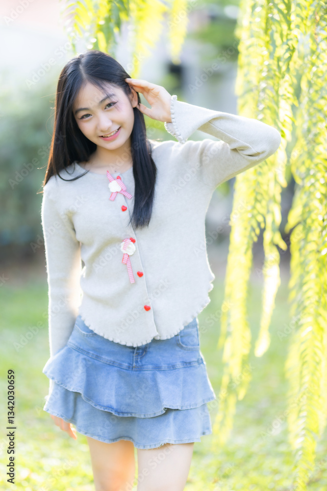 Portrait cute smiles Asian of attractive young teenage girl the cafe on vacation at a coffee shop in spring day