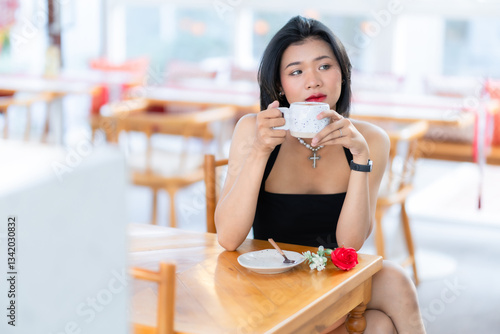 Obraz na płótnie valentine's day, Portrait beautiful asian people woman fashion model in summer Black dress and coffee in cup holding bouquet of red roses in the living room inside or cafe w salonie