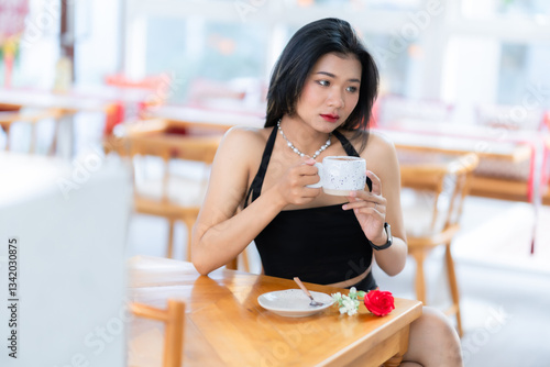 valentine's day, Portrait beautiful asian people woman fashion model in summer Black dress and coffee in cup holding bouquet of red roses in the living room inside or cafe