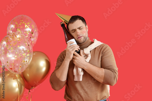 Drunk young man with lipsti...