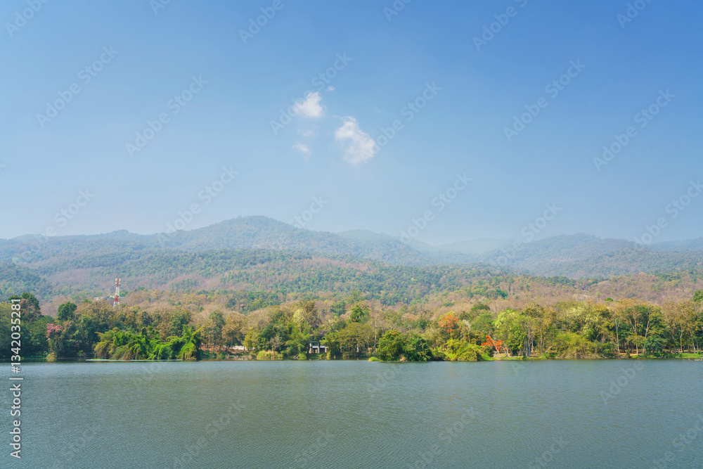 a public place leisure travel landscape lake views at Ang Kaew Chiang Mai University and Doi Suthep nature forest Mountain views spring cloudy sky background with white cloud.