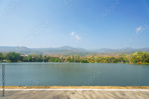 Obraz na płótnie a public place leisure travel landscape lake views at Ang Kaew Chiang Mai University and Doi Suthep nature forest Mountain views spring cloudy sky background with white cloud. w salonie