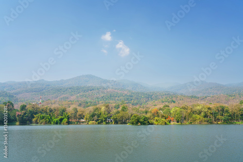 a public place leisure travel landscape lake views at Ang Kaew Chiang Mai University and Doi Suthep nature forest Mountain views spring cloudy sky background with white cloud.