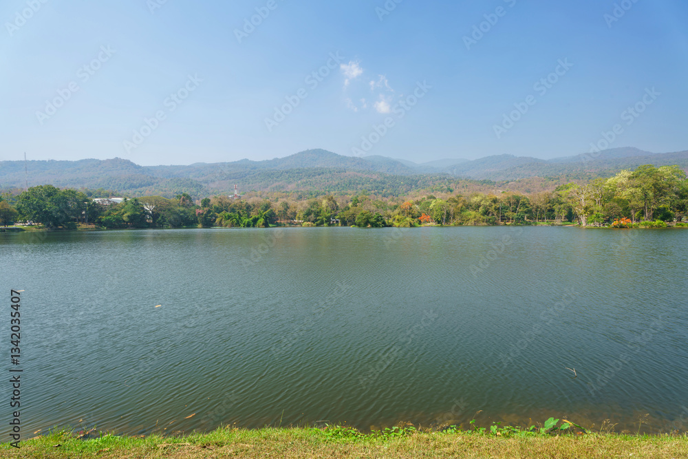 a public place leisure travel landscape lake views at Ang Kaew Chiang Mai University and Doi Suthep nature forest Mountain views spring cloudy sky background with white cloud.