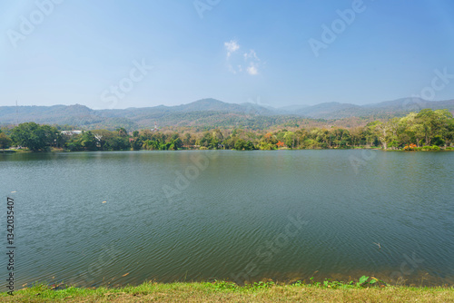 Obraz na płótnie a public place leisure travel landscape lake views at Ang Kaew Chiang Mai University and Doi Suthep nature forest Mountain views spring cloudy sky background with white cloud. w salonie